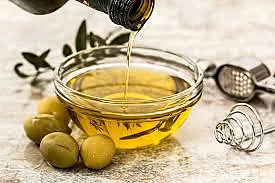 Add virgin olive oil to your salad to beat inflammation.