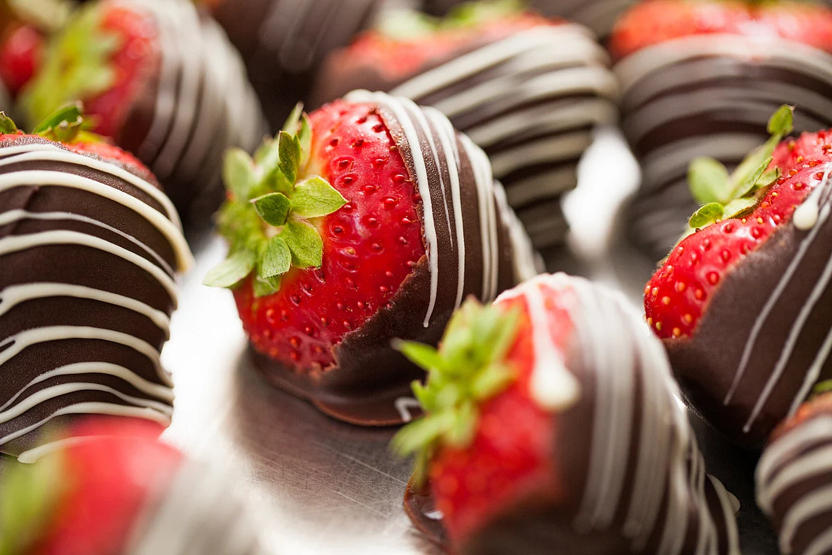 Pan dipped in dark chocolate for the adults, chocolate coated strawberries or fruit skewers with honey can be excellent options for kids.