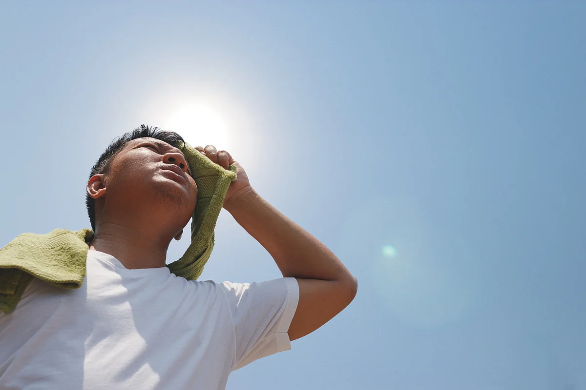The body tries to bring down the temperature by sweating.