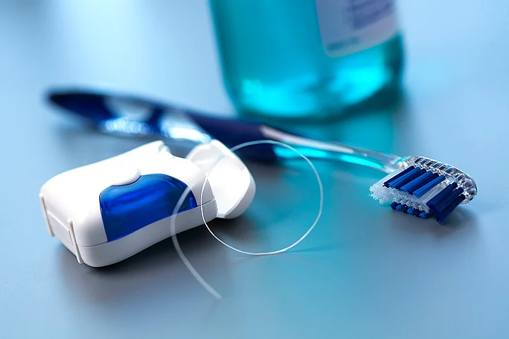 Flossing is a must along with rinsing with saline water to maintain oral hygiene.