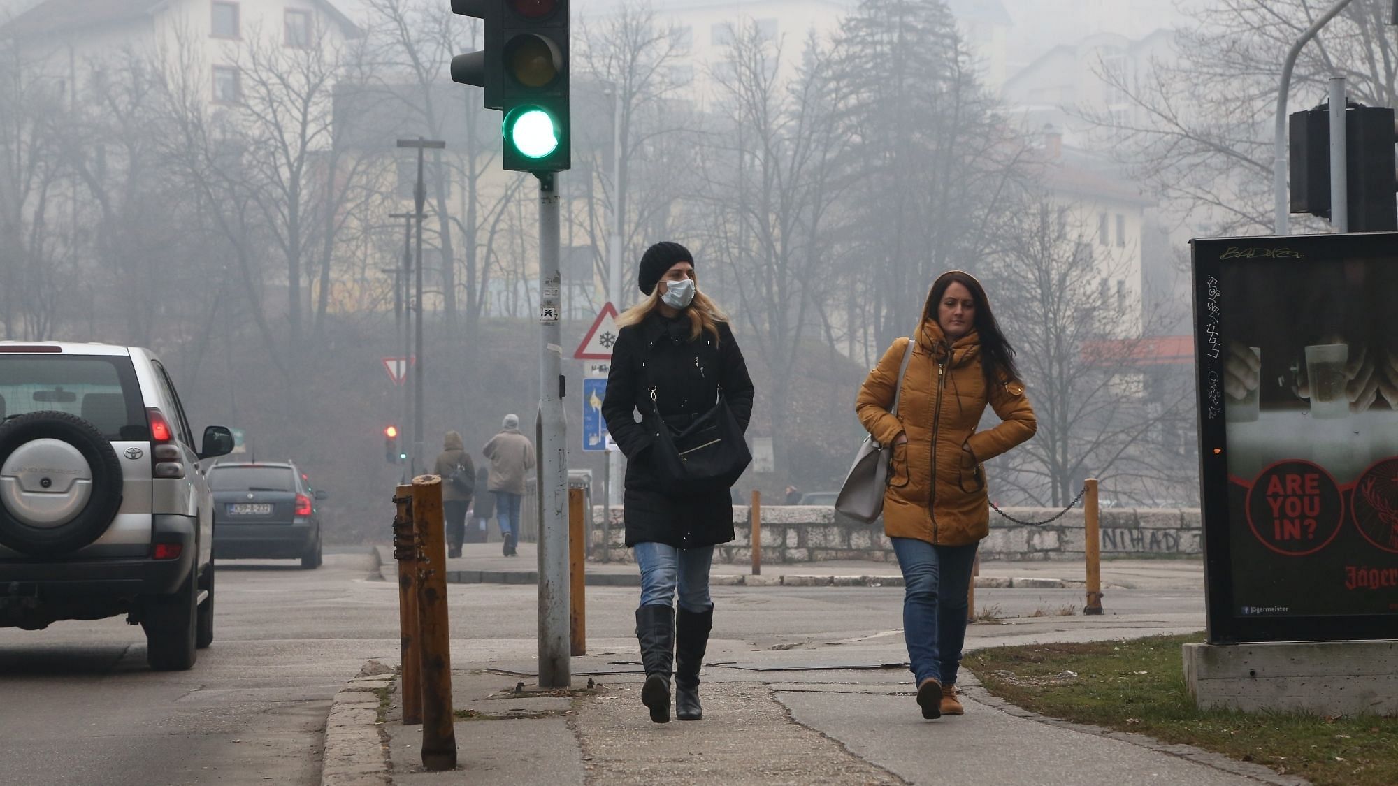 Air Pollution: People walk on the streets of Sarajevo - the capital of Bosnia and Herzegovina wearing masks so as to avoid breathing polluted air.