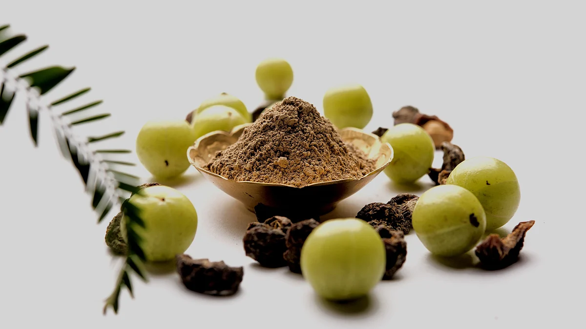 Take one spoon of amla powder with warm water every day.