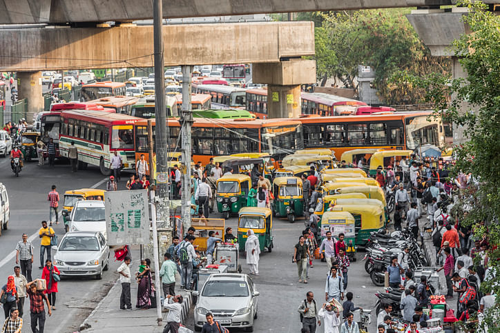 Big trafic with TukTuks, buses and people in New-Delhi, India &nbsp;