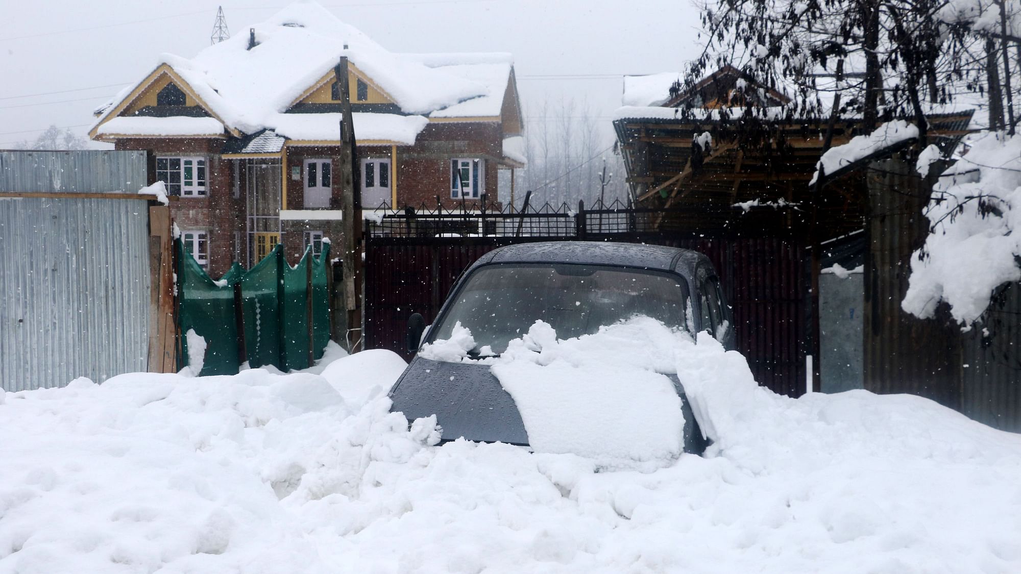 In Pics: Power Outage In J&K, Valley Cut Off After Heavy Snowfall