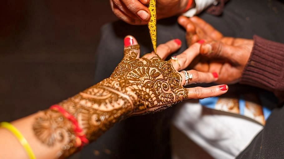 Beautiful woman dressed up as Indian tradition with henna mehndi design on  her both hands to celebrate big festival of Karwa Chauth, Karwa Chauth  celebrations by Indian woman for her husband -